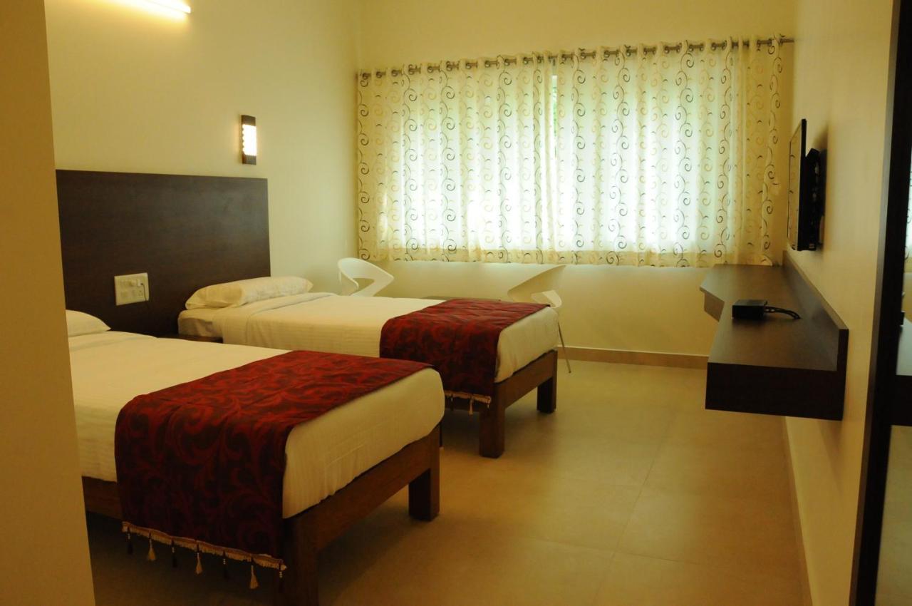 Palguni Residency Hotel Hassan Exterior photo